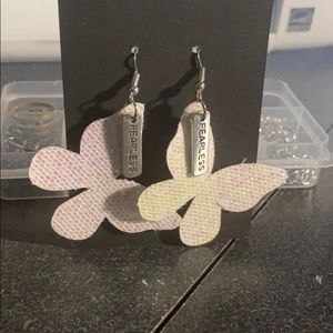 Faux leather earrings with charm